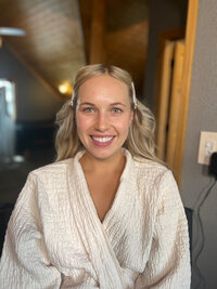 Bride before makeup in white robe