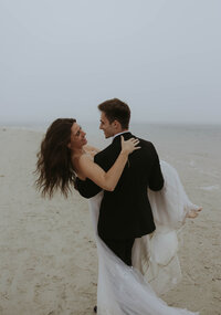 couple looking each other in the eyes during bridal shoot after just saying "I do"