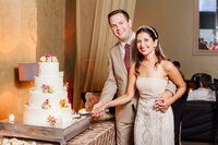 Bride and groom cut their wedding cake