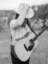 Mikaela Kahn's husband Jordan with his guitar