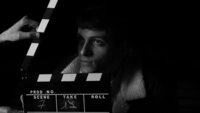 actor with a film clacker board
