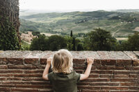 Boy Looking at Tuscan Countryside