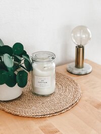 Candle on rattan placmat