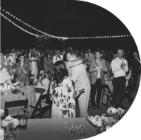 Woman waving and smiling at conference