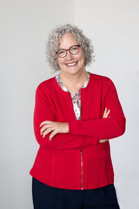 woman headshot with red sweater