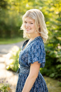 Professional senior portrait of a high school student in Northville, captured in a modern, clean outdoor location with a relaxed and confident look.
