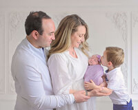 McKinney newborn on a simple white background for an in home newborn photo session in McKinney TX.