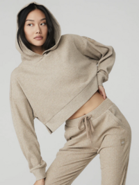 woman modeling a tan hoodie and pants
