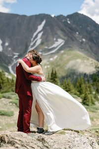 Bride and groom hug after exchanging private vows during Colorado elopement.