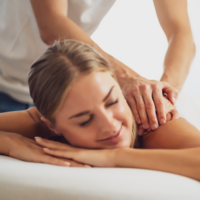 woman receiving a massage from massage therapist