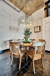 Dining area with chandelier  in this 3-bedroom, 2-bathroom luxury condo in downtown Waco, TX