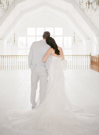 Bride and Groom with white outfits at Luxury Wedding Planned by Maila Enea in London & Sicily