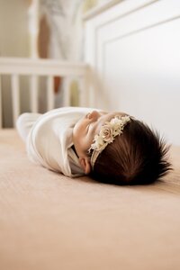 baby girl sleeps in her crib