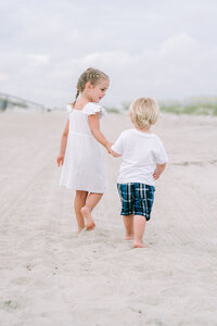 Little boy and girl walking on the beach at Shipyard Plantation in Hilton Head, SC. Savannah family photographs.