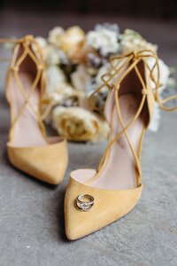 Yellow strappy heels with rings