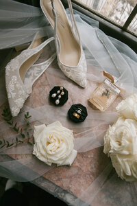 bridal veil and white dress with layers and tulle. golden hour bridal portraits in reception space at the brim in kcmo