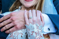 couple hold eachother to show off engagement ring in phoenix