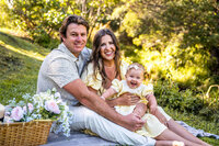 Sunset beach family portrait with palm trees by a Big Island family photographer