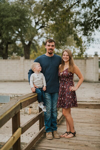 Owner of Hive and Harmony, Shawna, posing with her husband and son