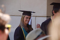 Website copywriter Erika Fitzgerald wearing a graduation cap and gown