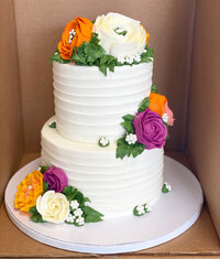 custom wedding cake with pink flowers on top