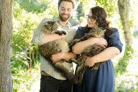 Aubre outside with her partner and two rescue cats