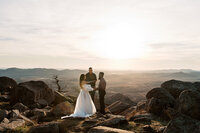 ouple exchanging vows during a sunset elopement on Mount Scott in Oklahoma, captured by a Texas elopement photographer.