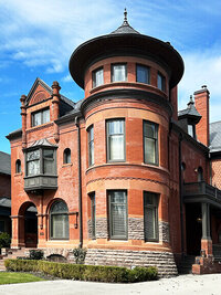 Arched stone, slate roofs, and crooked porches—details often overlooked on quiet blocks of Toronto’s historic residential neighborhoods.