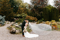 Bride and groom holding hands and walking