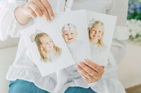 two hands holding three heirloom photography prints