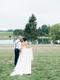 couple kissing in a park taken by baltimore film wedding photographer Nicole SImensky