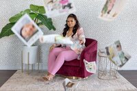 Content creation for entrepreneurs featuring a beautiful client in her office, playfully engaging with key business images. Captured during a brand photography session