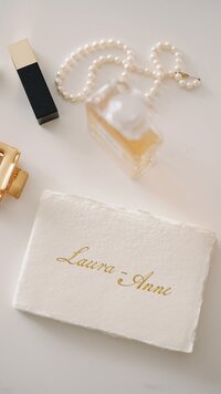 Smelle candle company box packaging laying on smooth fabric