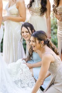 Scottsdale-Wedding-Photographer-and-Videographer-Private-Residence-Bridesmaids-fluffing-dress-HuffoWed-1162