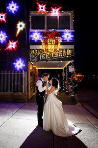 city wedding bride and groom sharing icecream