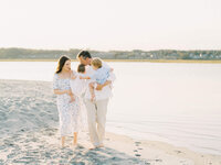 family of four during a sunset session on the coast of Maine