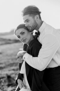 Bride and groom embrace
