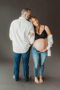 bare belly maternity session with husband and wife