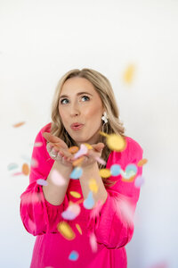 Personal stylist in Missouri blowing confetti
