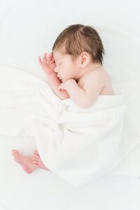 newborn baby boy laying in photography studio near Goldsboro, NC