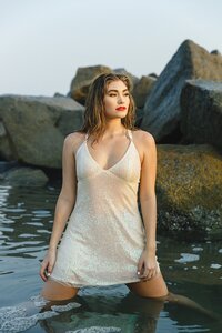 Santa Monica Pier senior photos at sunset with vibrant skies and ocean view – editorial senior portraits in Southern California