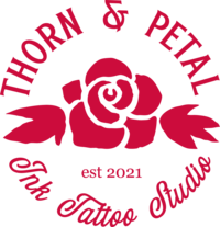 Thorn & Petal circular red logo