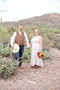 couple standing in the desert on their wedding day