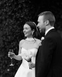 husband and wife reach out their hands
