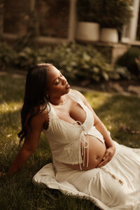 mom cradling her baby bump in nashville tn