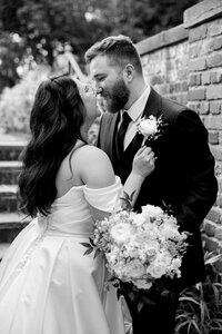 mom helping bride with dress