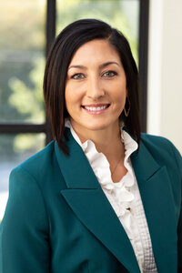 Headshot taken of woman in green jacket for a firm in Provo, Utah by Sara Vaz.