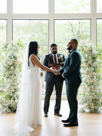 Bride and groom in the middle of their I dos and luxury wedding ceremony | Something Borrowed