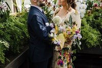 Bride and Groom in Volunteer Park Conservatory with Bouquet