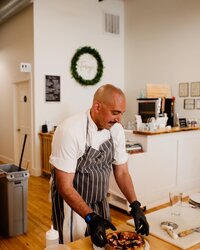 Chef in kitchen smiling
